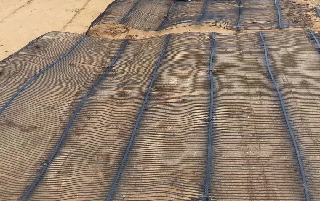 Geogrid slope stabilization and erosion control: what reinforces, what protects